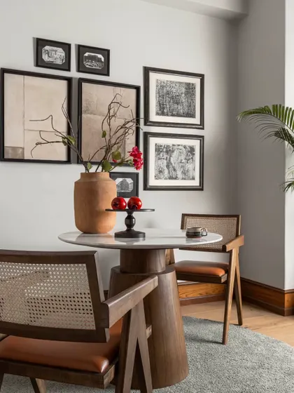 Personalizing my cabin was essential. I curated a gallery wall with meaningful art and set up a cozy reading or meeting spot with classic Pierre Jeanneret-style chairs, making the space a true reflection of my own design sensibilities.