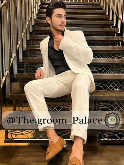 A clean, sharp look with a perfect fit. I tailored this white two-piece suit with a contrasting black shirt for a modern, high-fashion statement, ideal for a cocktail party or reception.