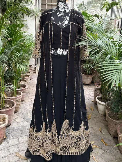 The full view of the black and gold jacket set. This is a versatile piece that can be styled in many ways.