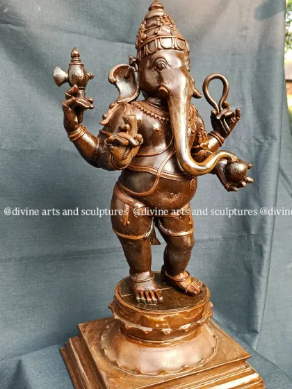 A close-up of the Ganesha wax model, highlighting the smooth finish and precise lines that are hallmarks of the Swamimalai bronze tradition.