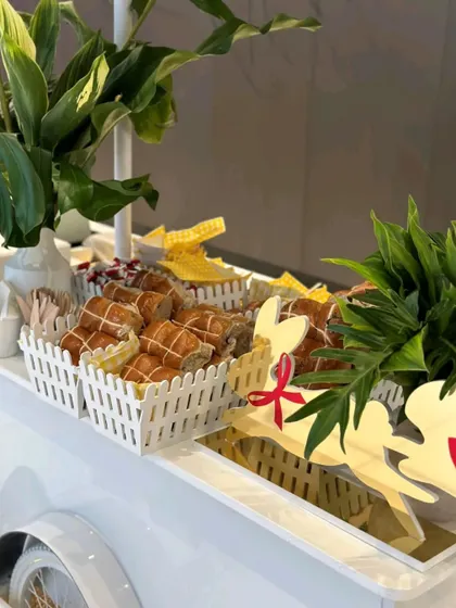 A charming food cart setup for a Christmas-themed event. We served festive treats from this cart, which was decorated with reindeer cutouts and other holiday details.