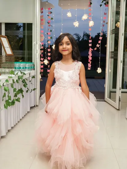 A beautiful portrait of a birthday girl in her party dress. I focus on making children feel like the star of the show on their special day.