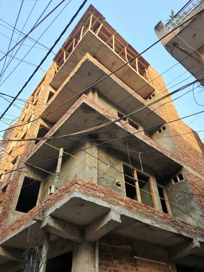 The same 22'6"x30' project during the construction phase. This image shows the bare concrete and brick structure, providing a direct comparison to the final render and showcasing our ability to translate design into reality.