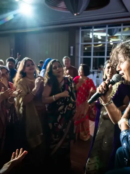 Interacting with the lovely audience at the Diwali Ball in Singapore. We often step off the stage to make the experience more personal and engaging.