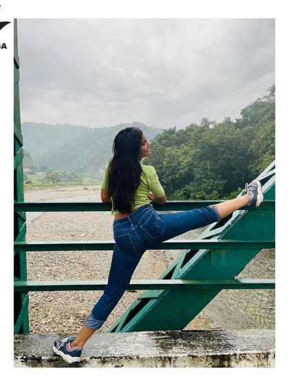A simple, mindful stretch in the midst of nature. This shows that yoga isn't always about complex poses; it's about creating space in your body and mind.
