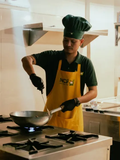 Here I am in my kitchen, preparing your meals with care. I believe in a hands-on approach, ensuring every dish has that authentic, home-cooked taste.