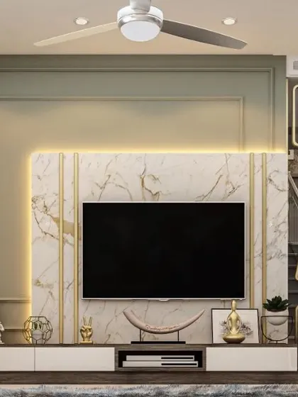 Part of a full villa project, this TV unit combines a marble back panel with gold-toned vertical accents and soft backlighting. The design is both functional and serves as a key element of the room's luxurious decor.