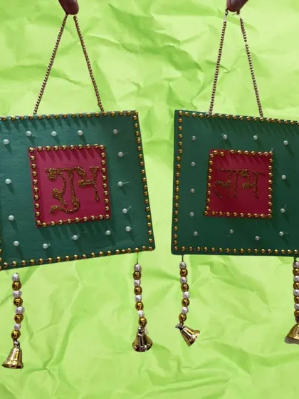 Another beautiful "Shubh Labh" hanging, this one in green and red with bells. Kids love making their own festive decor.