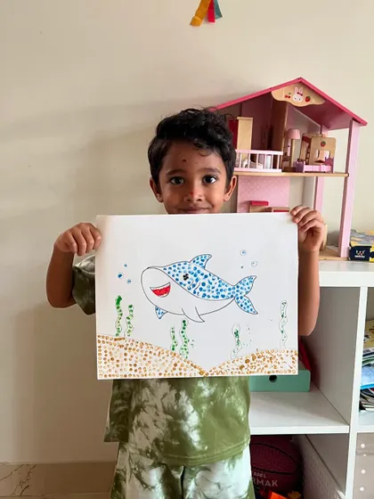 This happy shark was made entirely of little dots! Using cotton buds to paint is a fun way to practice the pointillism technique and create textured art.