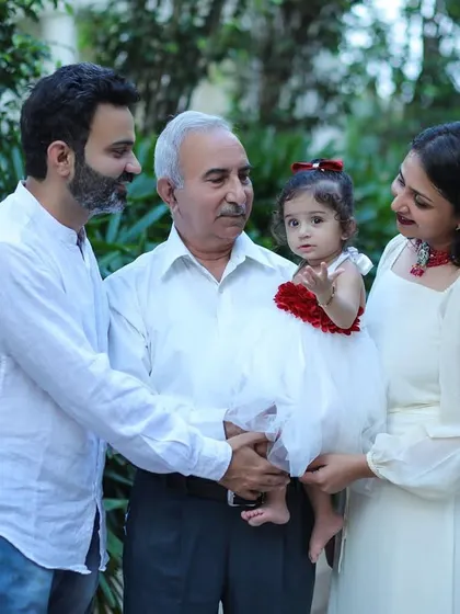 Three generations together in one frame during an outdoor family photoshoot. Including grandparents in your session creates a priceless legacy for your family to cherish.