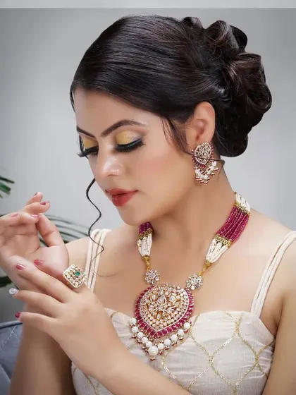 A high, voluminous updo created for a professional photoshoot. This dramatic style is perfect for editorial looks or for a bride wanting a high-fashion statement.