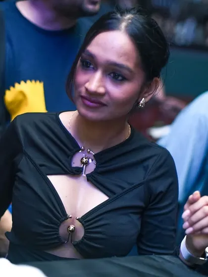 A stylish attendee enjoying the music. The Grind is a fashionable affair.