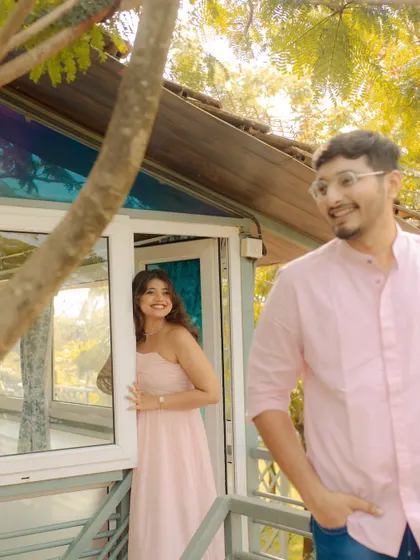 A sweet, candid moment of peek-a-boo at a cozy villa. This playful interaction shows the couple's comfortable and easy chemistry.