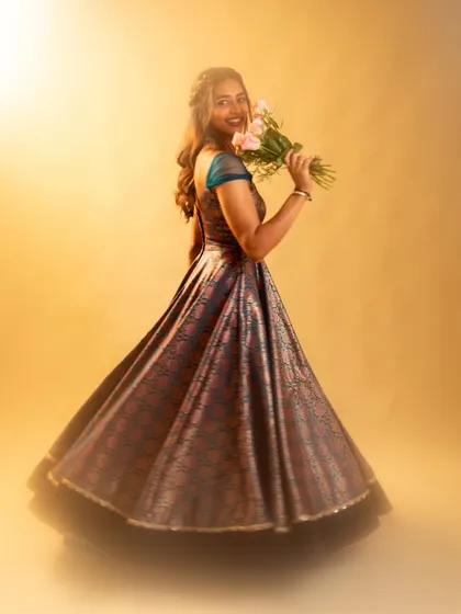 A full-length shot showing the gorgeous flare of the iridescent gown, designed for making a grand entrance.