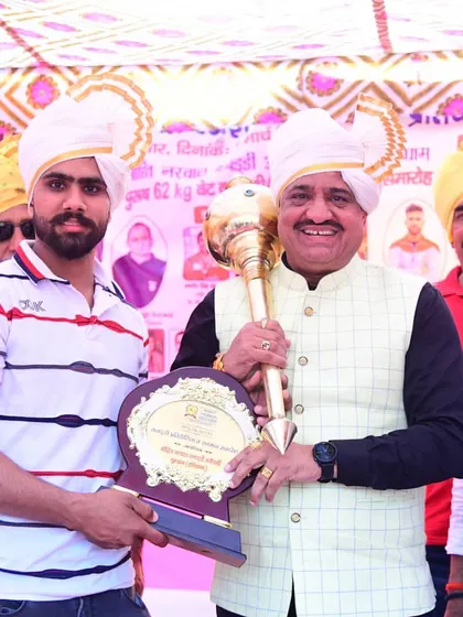 A moment of honor as I receive a memento from the legendary coach Shri Randhir Singh Sehrawat.
