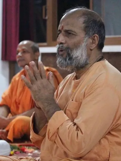 A moment of deep absorption during a kirtan session. The vibrations of the chants have a profound effect on one's entire being.