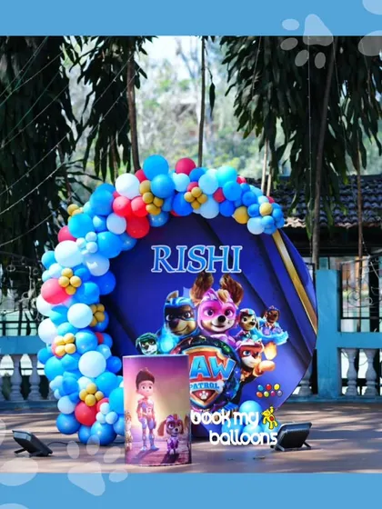 No job is too big, no pup is too small for Rishi's Paw Patrol party. This setup featured a circular backdrop with the whole pup crew and a vibrant balloon arch in the classic red, blue, and yellow Paw Patrol colors.