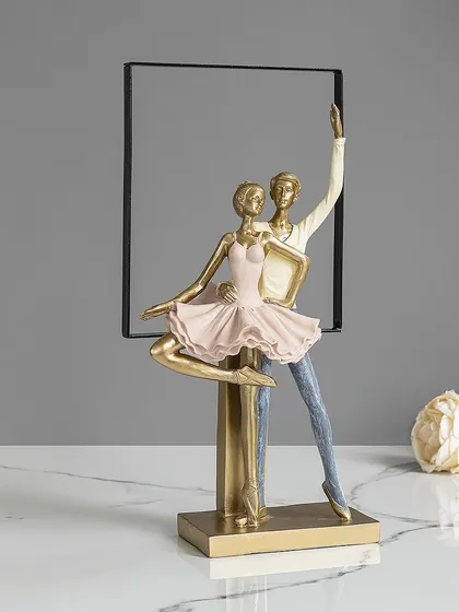 This elegant showpiece features a dancing couple, framed by a modern, abstract shape. It's a beautiful representation of grace and partnership, making it a perfect gift or decorative accent.