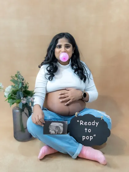 Let's have some fun. This casual studio portrait shows the playful side of pregnancy. We love incorporating personal touches like your ultrasound photo and fun props to make your session uniquely yours.