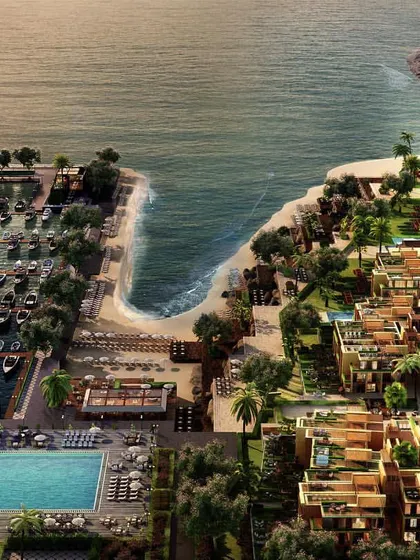 An aerial 3D visualization of a sprawling coastal villa community and marina. This bird's-eye view captures the full scope of the development, including the layout of the residences, the poolside amenities, and the arrangement of boats in the harbor, providing a comprehensive overview for potential investors.