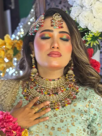 A close-up of the vibrant, multi-colored eyeshadow I created for this Haldi look. The blend of yellow, green, and orange on the eyes perfectly captures the festive spirit of the ceremony.