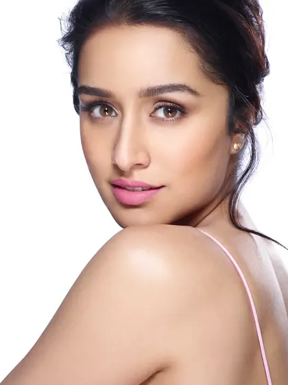 A clean and classic beauty portrait of Shraddha Kapoor. The simple lighting and soft focus highlight her natural features, making it an ideal shot for a skincare or cosmetics campaign.