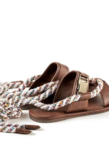 A shot showing the full length of the rope ties on the Jeetinder Sandhu sandals, emphasizing their unique wrap-around design feature.