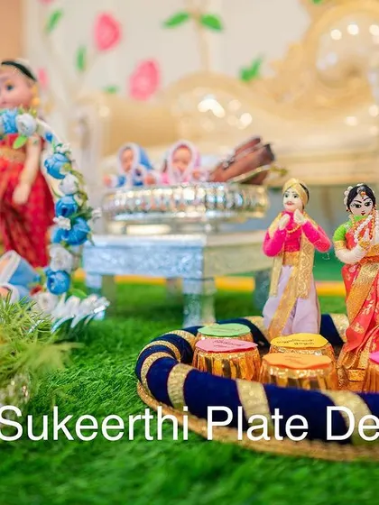 The heart of my decorations is the handmade dolls. Here you can see a close-up of a traditional couple doll set, crafted with attention to detail, which adds a beautiful, personal touch to any ceremony.