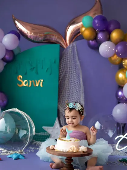 A mermaid's first taste of cake! We can combine our themed shoots with a cake smash for an extra special first birthday celebration.