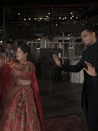 The bride and groom enjoying a dance together, lost in the music and the magic of their Sangeet night.