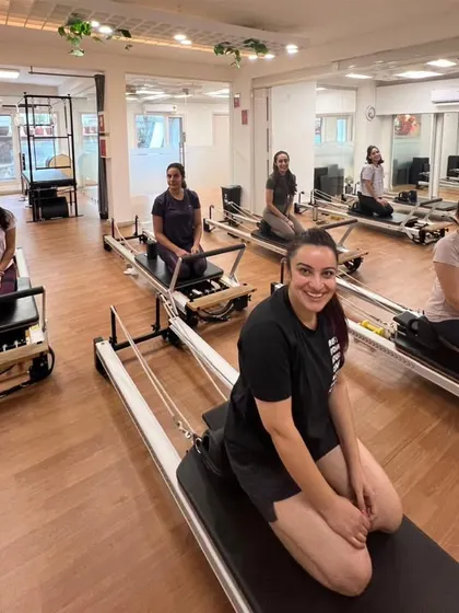 Various shots of members and instructors in action during our dynamic Reformer Pilates classes.