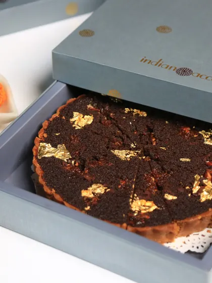 Indulge in our exclusive dessert gift boxes, crafted to elevate your Diwali celebrations. This doda burfi treacle tart, elegantly packaged, makes for an ideal festive gift.