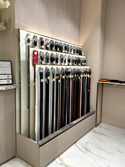 A custom-designed sliding display unit for belts. This is an example of our bespoke fixture design to solve specific product display challenges.