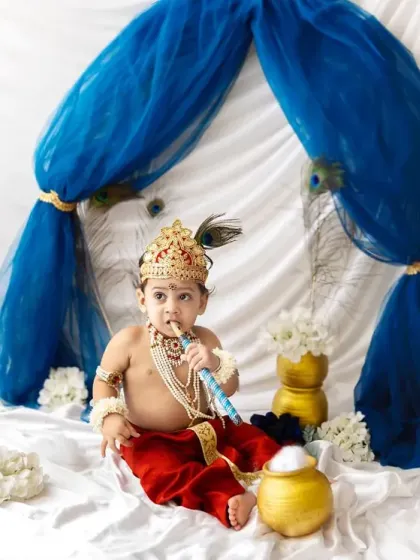 Playing the flute just like Lord Krishna. Dressing up for festive shoots is a wonderful way to create unique and memorable photos of your baby.