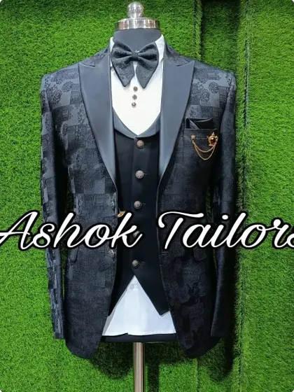 A black patterned three-piece suit, perfect for parties and receptions.