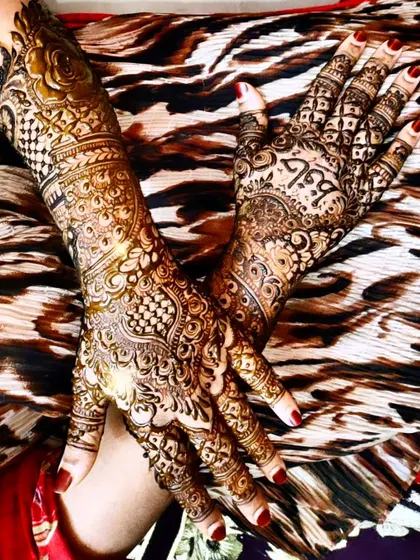 A different angle of the same bridal design, showing how the patterns wrap around the hands.
