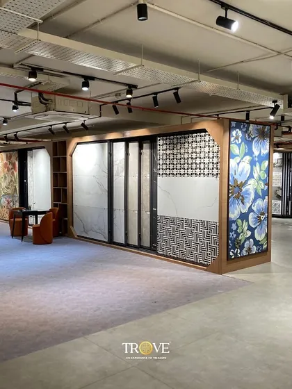 This is a glimpse of the variety you'll find at my Mysore Road location. Notice the different display systems, from sliding panels for large slabs to curated sections for floral and geometric patterns, making it easy to compare styles.