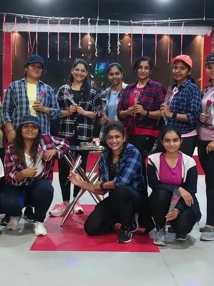 Our members holding roses during the Women's Day celebration. Small gestures of appreciation make our community feel like a family.