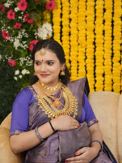 Another portrait of Varsha at her baby shower. She looks serene and beautiful, with makeup that highlights her features without being overpowering.