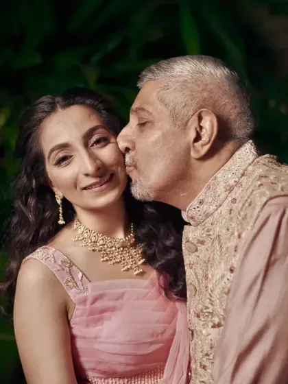 A touching moment between the bride and her father on her engagement day.