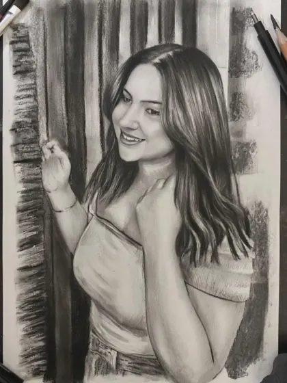 A charcoal sketch capturing a woman's bright smile and the flow of her hair.