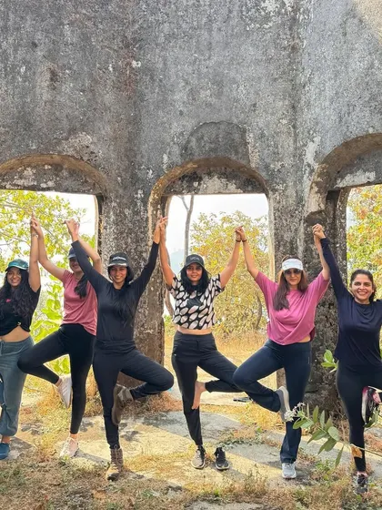 A fun moment with my yoga community during an outdoor excursion. We are holding hands in Tree Pose, celebrating our connection and the end of the year together.