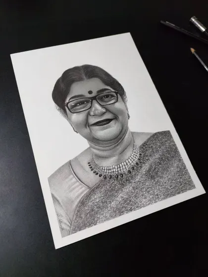 A commissioned black and white pencil portrait for a client from Raipur. I focused on capturing her kind eyes and the detailed jewellery she was wearing.