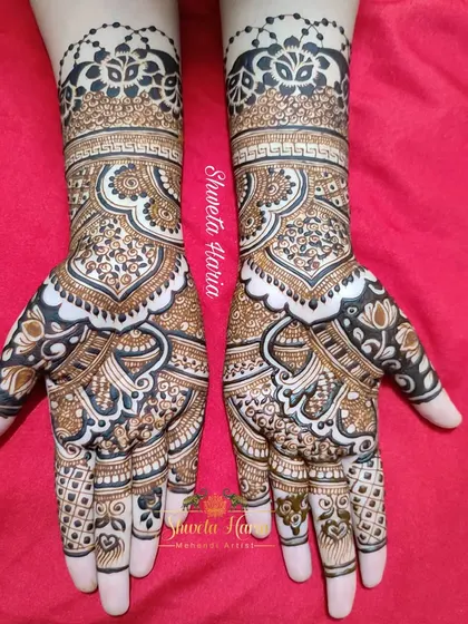 A beautiful fusion of traditional and floral styles. This full-coverage design features large, intricate paisley shapes filled with delicate flowers and leaves, creating a flowing and organic look.