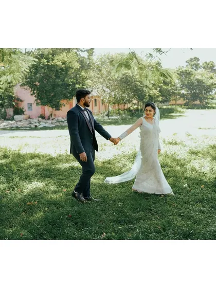 A classic and elegant post-ceremony portrait of a Christian couple. The simplicity of the natural surroundings highlights the beauty of their union.
