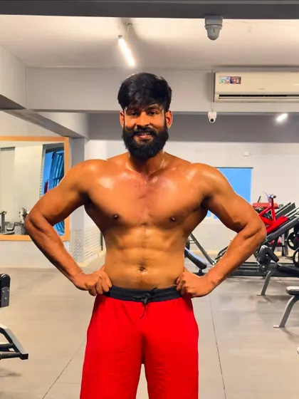 Another post-workout pose, smiling with the satisfaction of a session well done.