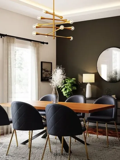 A sophisticated dining room with a dark accent wall, quilted black chairs with gold legs, and a modern sputnik chandelier, creating a moody and luxurious ambiance.