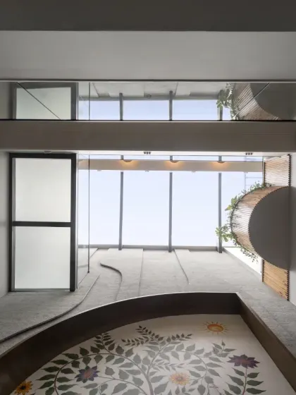 A worm's-eye view of the Slender House skylight. This feature is critical to the design, bringing natural light deep into the narrow home and creating an ever-changing play of light and shadow on the floral mosaic floor below.