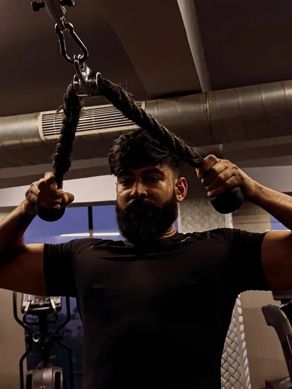 "Jhukega nahi." A tricep rope pushdown, a testament to the attitude of never backing down.