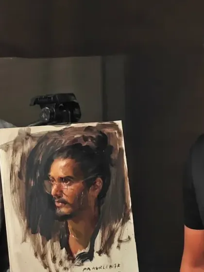 With a talented artist and his portrait of me, created during a workshop. It's humbling to be the subject of such skill.